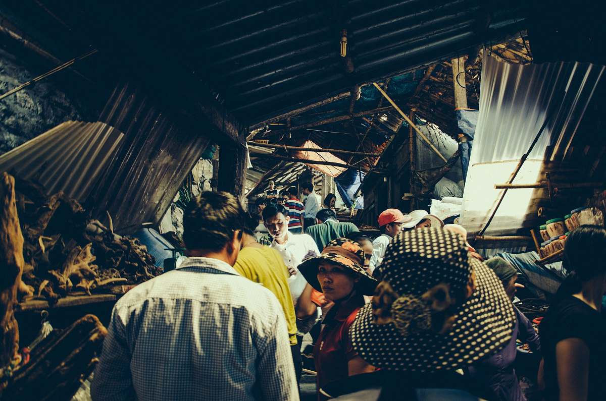 hoa binh group of people standing inside structure vietnam